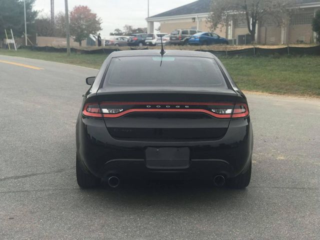 Black Dodge sedan rear view